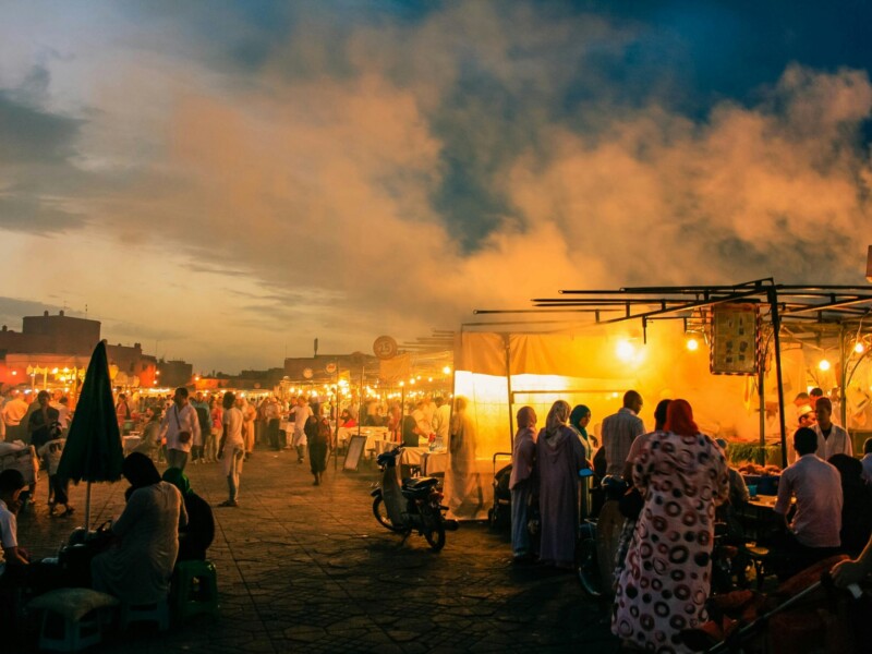 Jemaa el-Fnaa square night market stalls with golden lights Marrakech