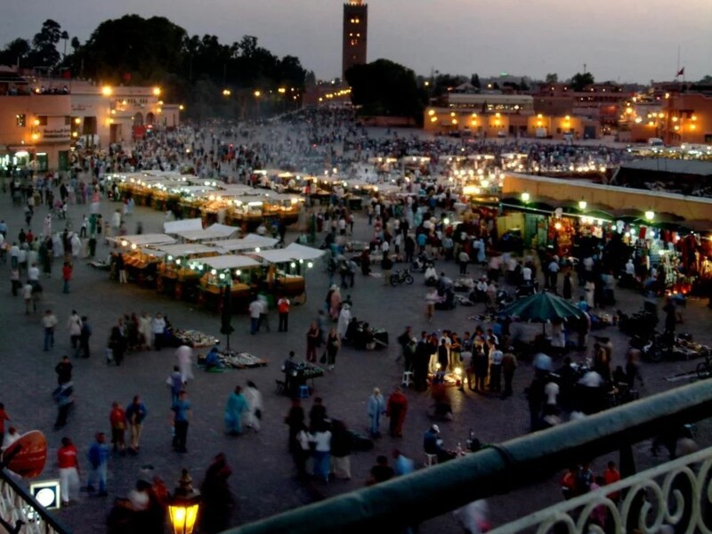 Jemaa el-Fnaa square Marrakech evening market vendors crowds minaret