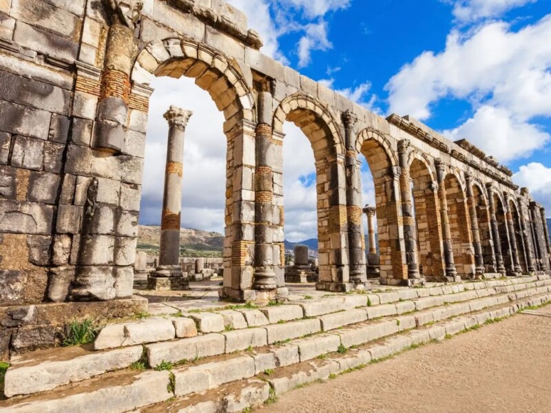 Ancient Roman aqueduct arches ruins Volubilis Morocco archaeological site