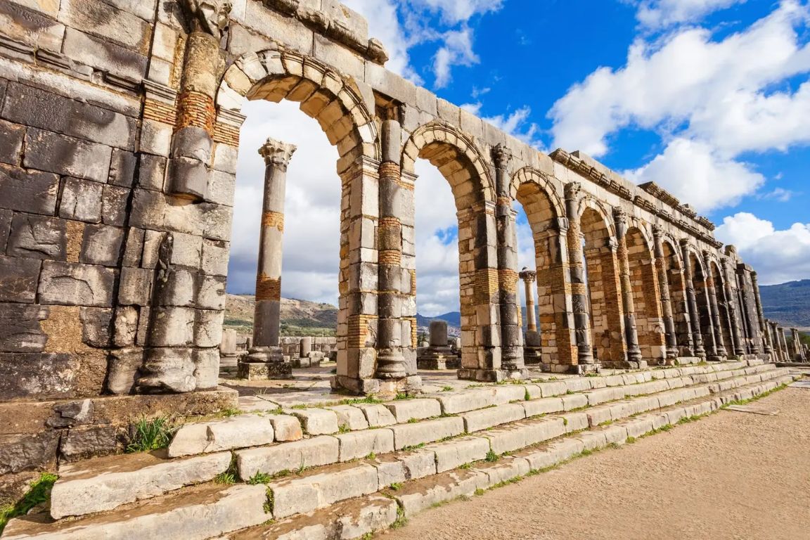Ancient Roman aqueduct arches ruins Volubilis Morocco archaeological site