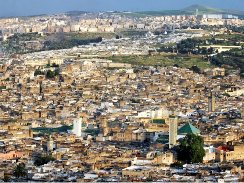 Aerial view of Fez medina with historic mosques and dense architecture