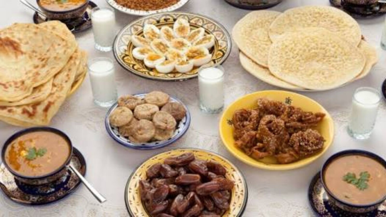 Traditional Moroccan Ramadan breakfast spread with breads dates and soup