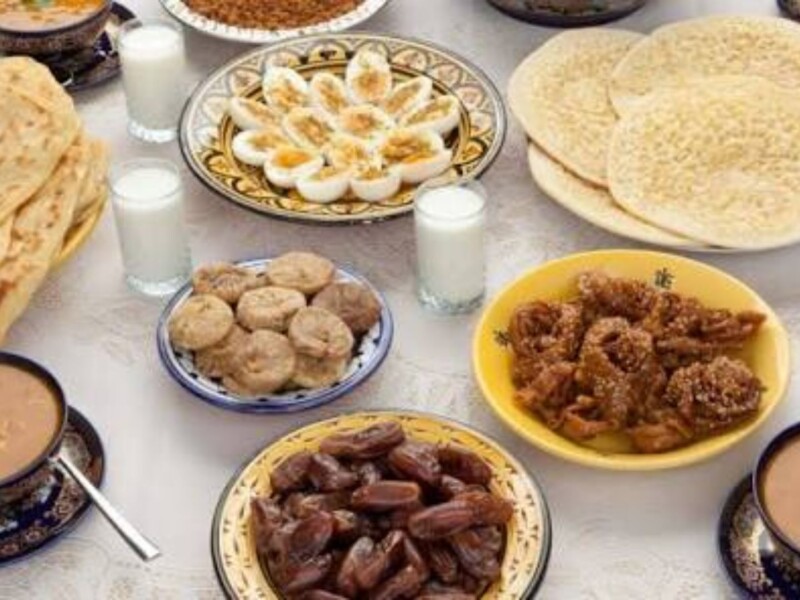 Traditional Moroccan Ramadan breakfast spread with breads dates and soup